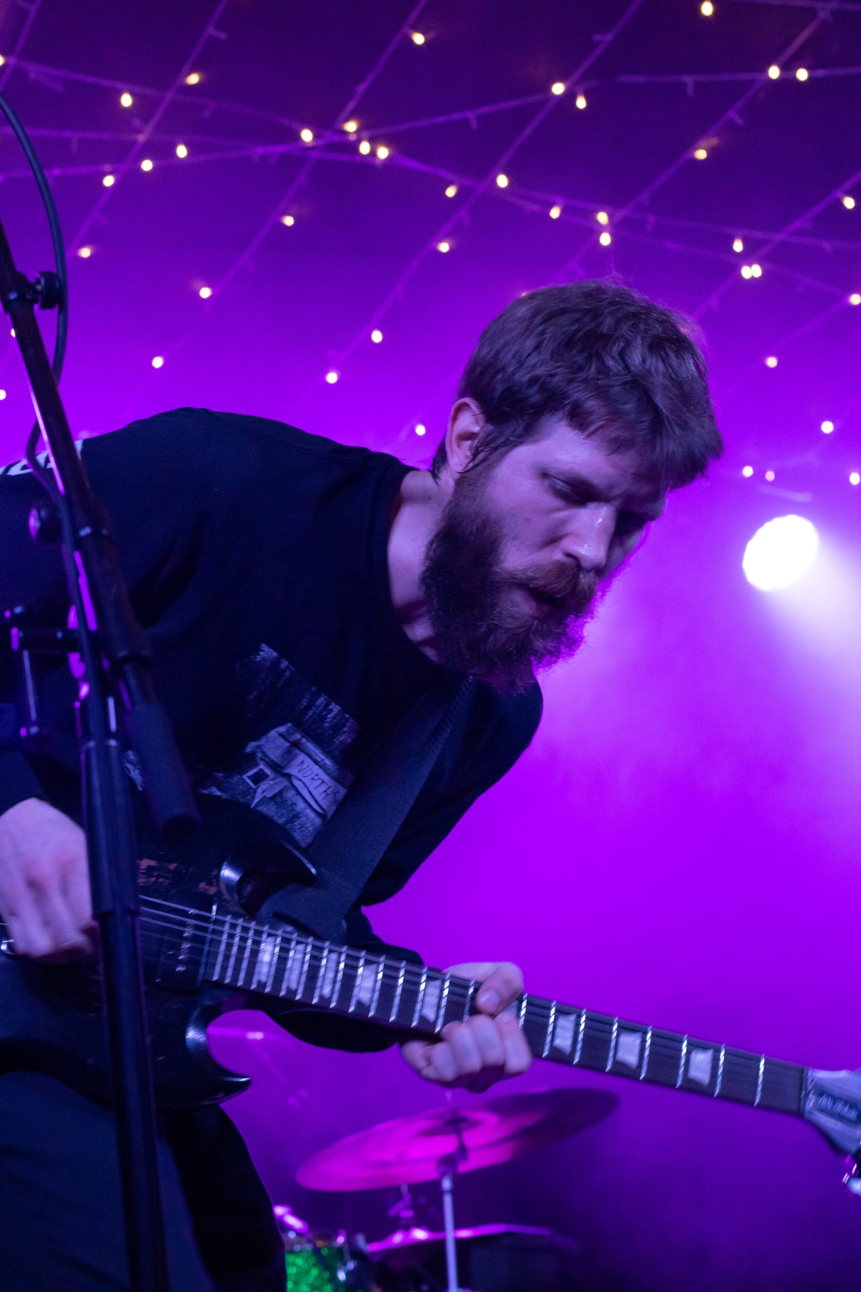 Motherhood guitarist performing.