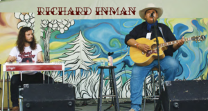 Richard Inman performing on stage alongside Ryan Funk on pedal steel.