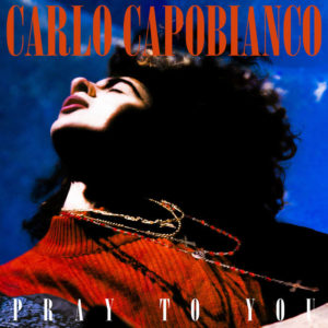 Orange text on top reads "Carlo Capobianco" and bottom text reads "Pray to You." Profile headshot of a person looking up.