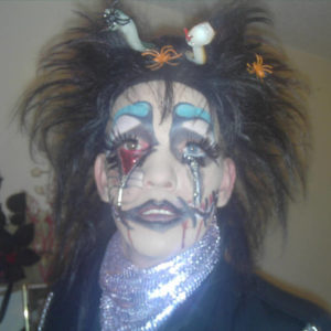 Headshot of a person with theatrical makeup.
