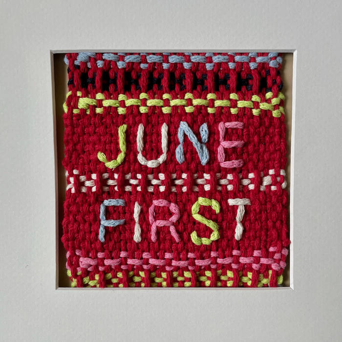 "June First" stitched into a knit wall hanging 