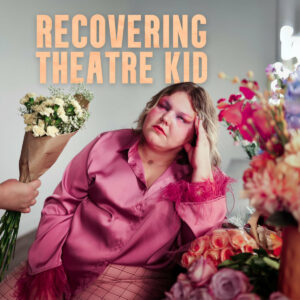 Artist positioned in the center below light orange title text "Recovering Theatre Kid" with several bouquets of flowers to the right and a hand holding a bouquet out to the left.
