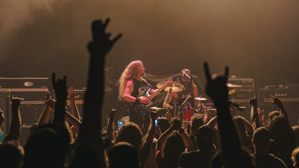 Hands in the air making rock sign during Manitoba Metal Fest