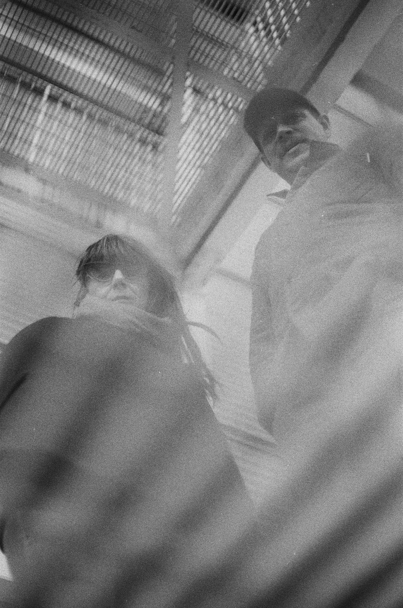 the members of Cloud Circuit, Deanna Radford and Jeremy Young, photographed by Audrey Legerot (from beneath a grate?)