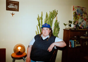 singer-songwriter FONTINE seated in front of a cactus